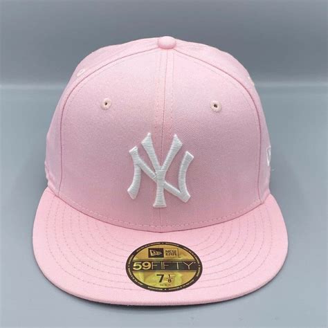 pink new era fitted hat.